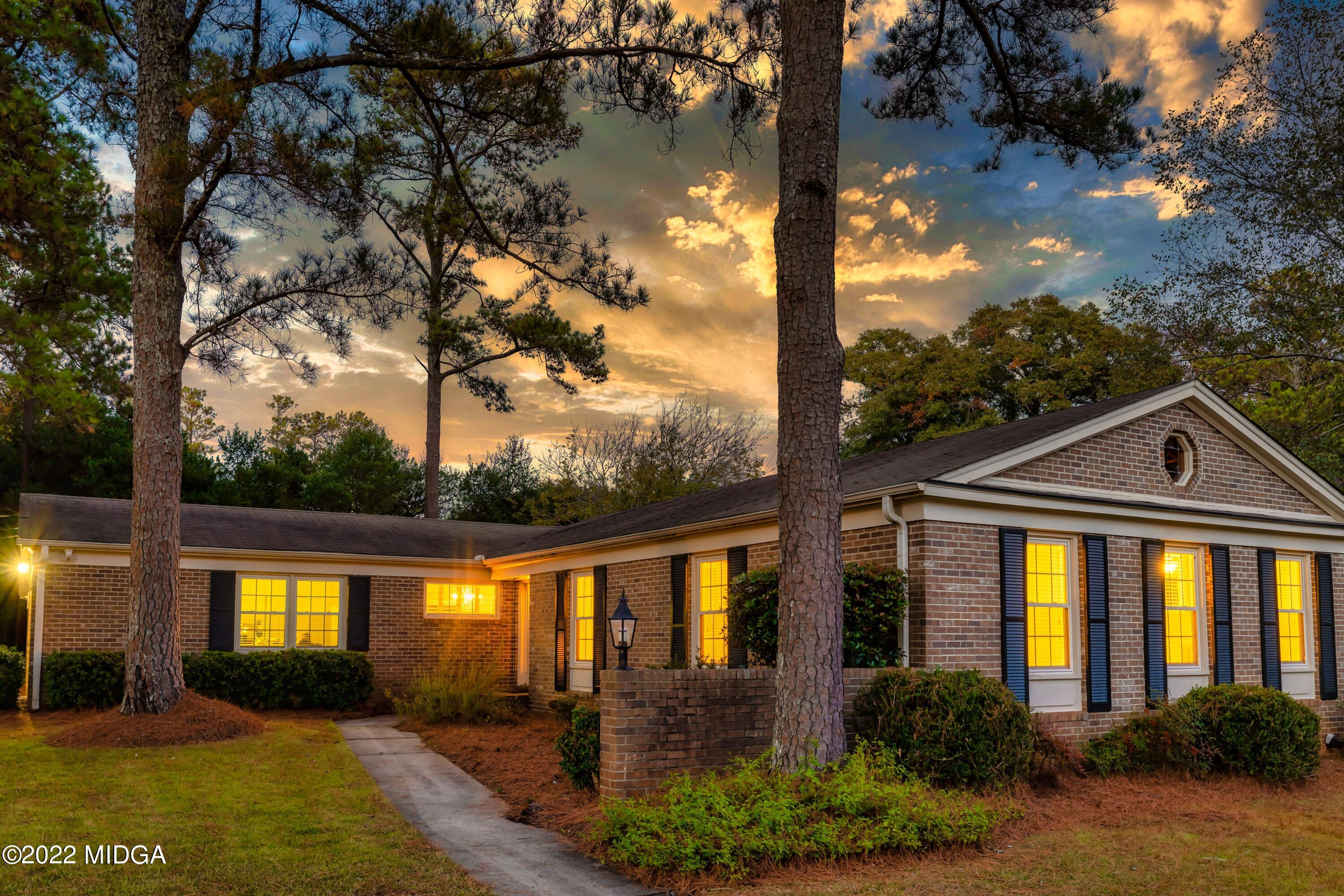 201 Larcom Lane Griffin, GA 30224 - Photo 63 of 64 a front view of a house with a yard balcony and outdoor seating
