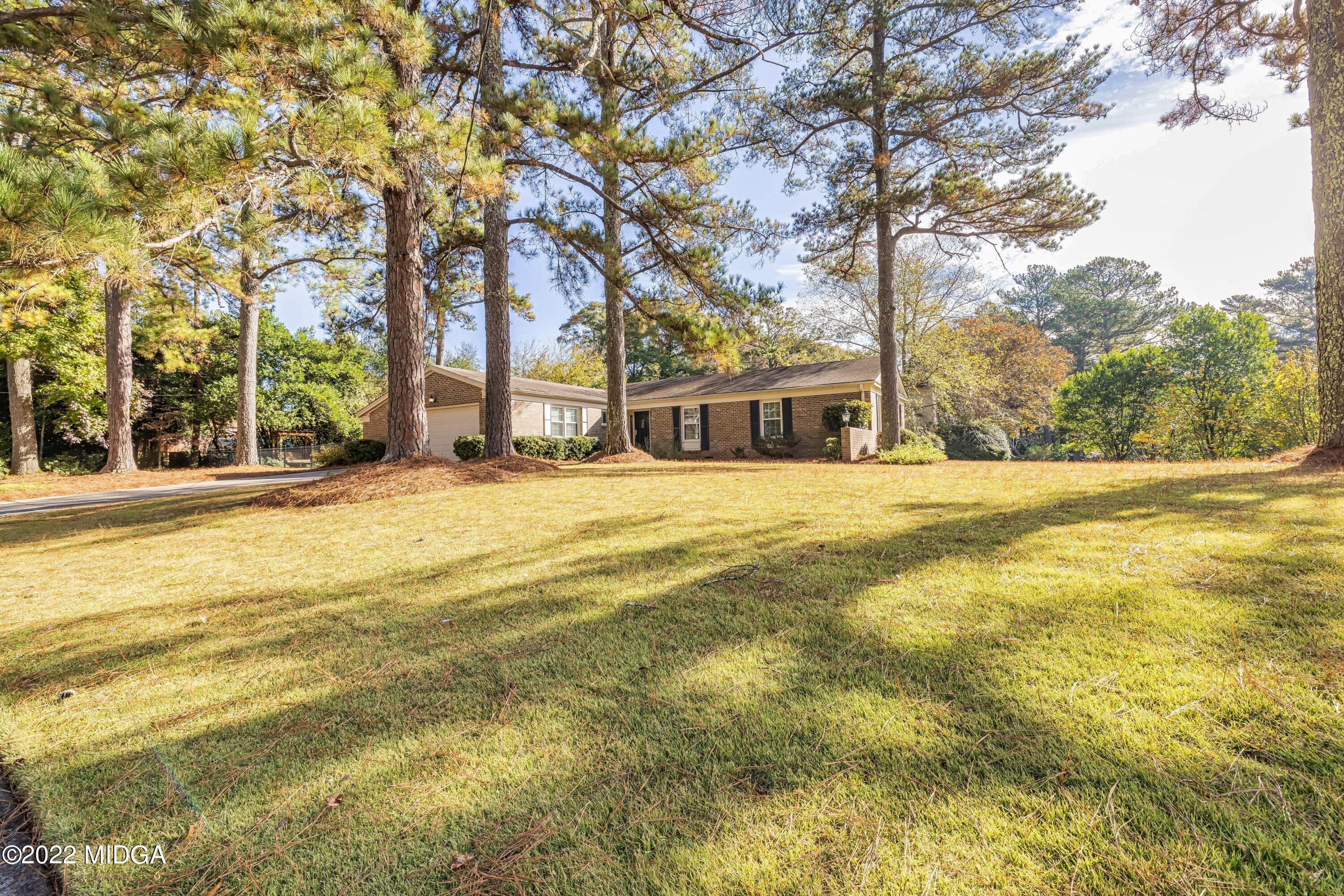 201 Larcom Lane Griffin, GA 30224 - Photo 8 of 64 a view of a swimming pool with an outdoor seating