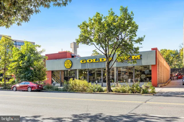 a view of a building with sitting area