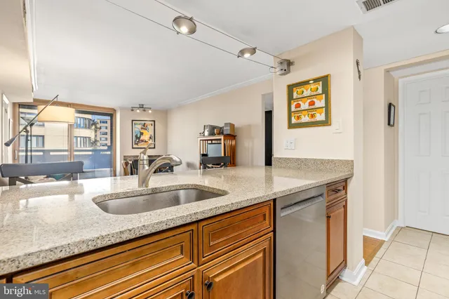 a kitchen with granite countertop a sink and a window