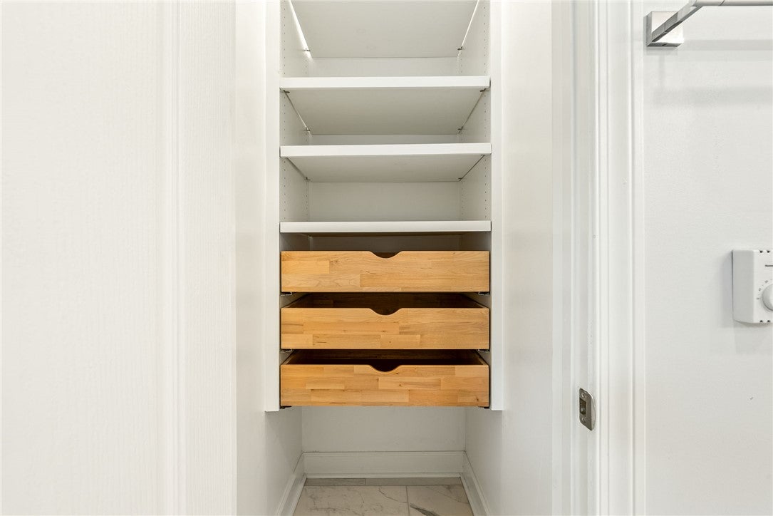1657 Abby Road Auburn, AL 36830 - Photo 21 of 39 This organized closet features ample shelving and convenient drawers for optimal storage solutions.