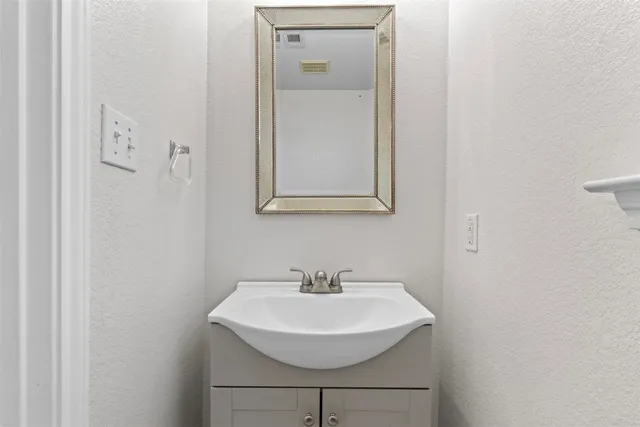 a sink with a mirror