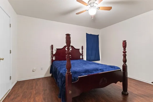 a bed room with furniture and wooden floor