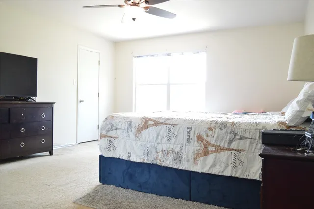 a living room with a couch and a flat screen tv