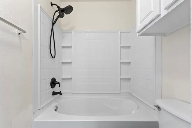 a close view of a bathtub in bathroom