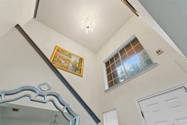 a view of an entryway with a chandelier