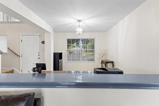 a kitchen with a counter space and a window