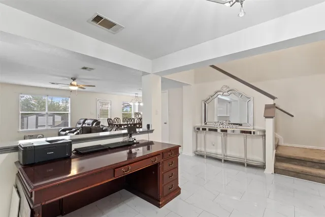 a view of living room with furniture and window