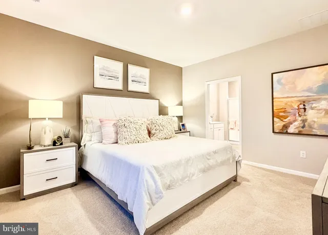 a bedroom with a bed and a night stand