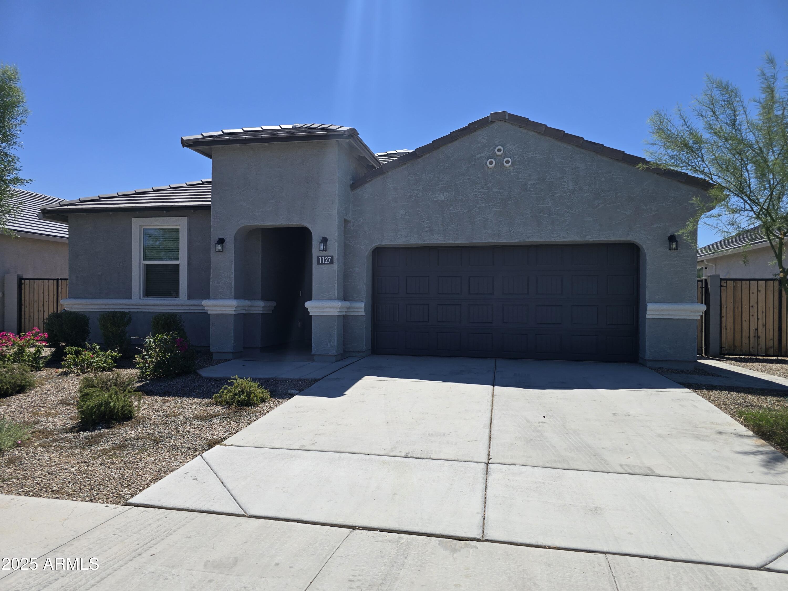 a front view of a house with garage