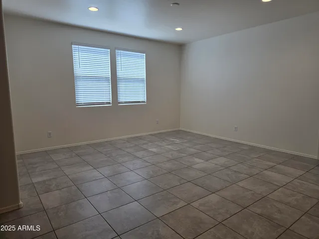 a bathroom with a granite countertop sink a mirror and a bathtub