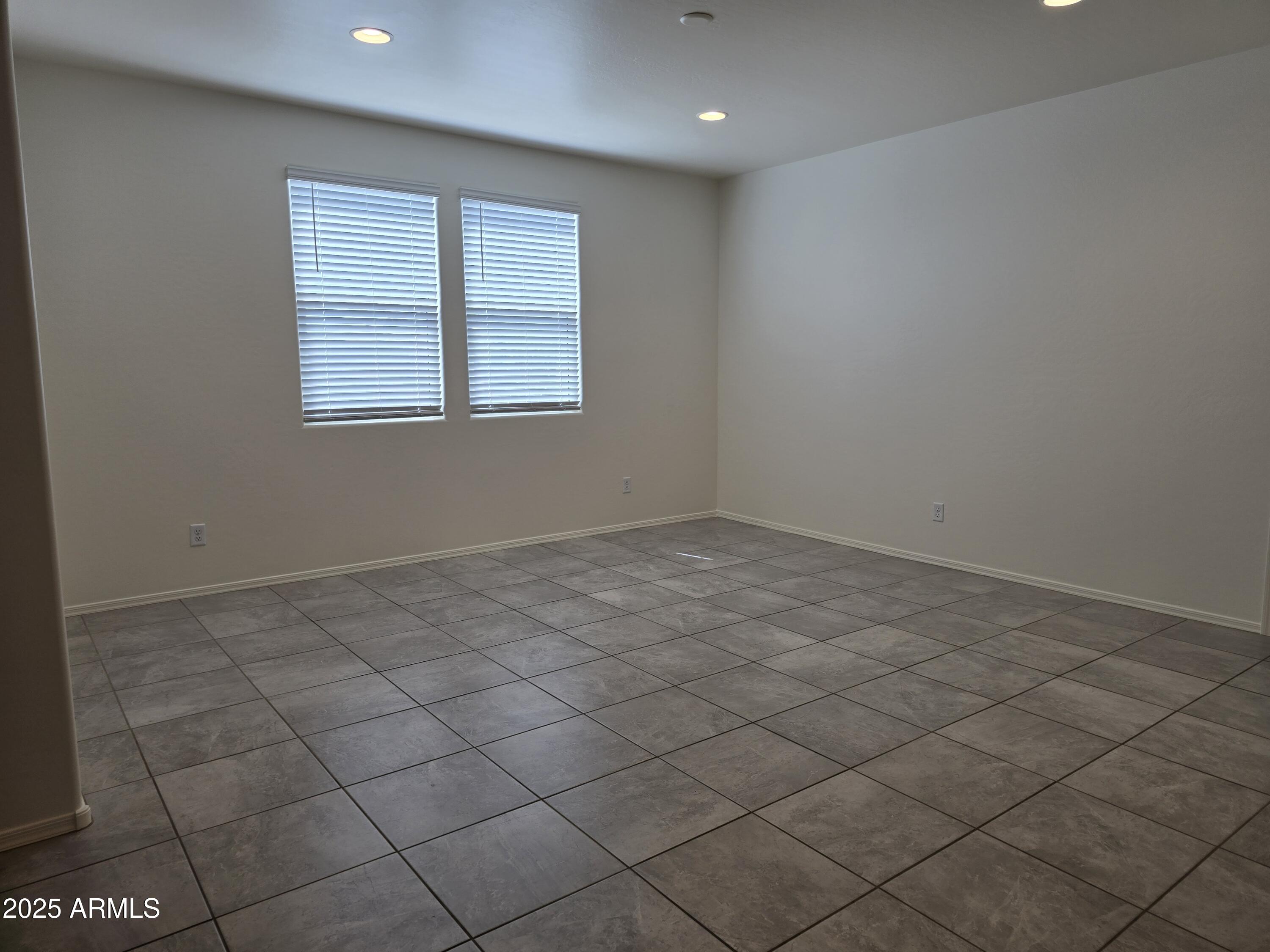 1127 West Sand Canyon Court Casa Grande, AZ 85122 - Photo 4 of 5 an empty room with windows