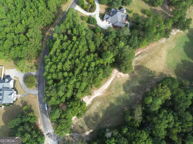 a backyard of a house with a yard and lake view