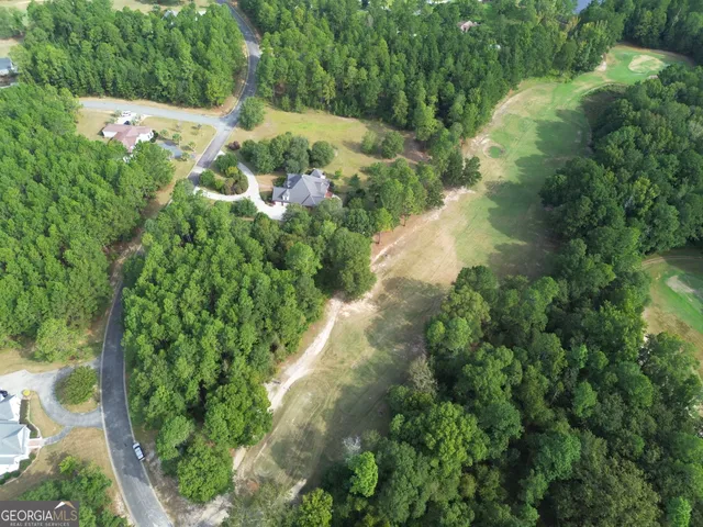 a view of a garden with a building
