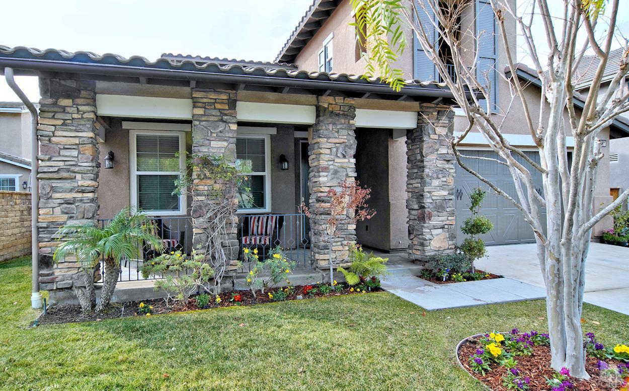 3522 Bridgehampton Way Camarillo, CA 93012 - Photo 2 of 52 a front view of a house with a yard
