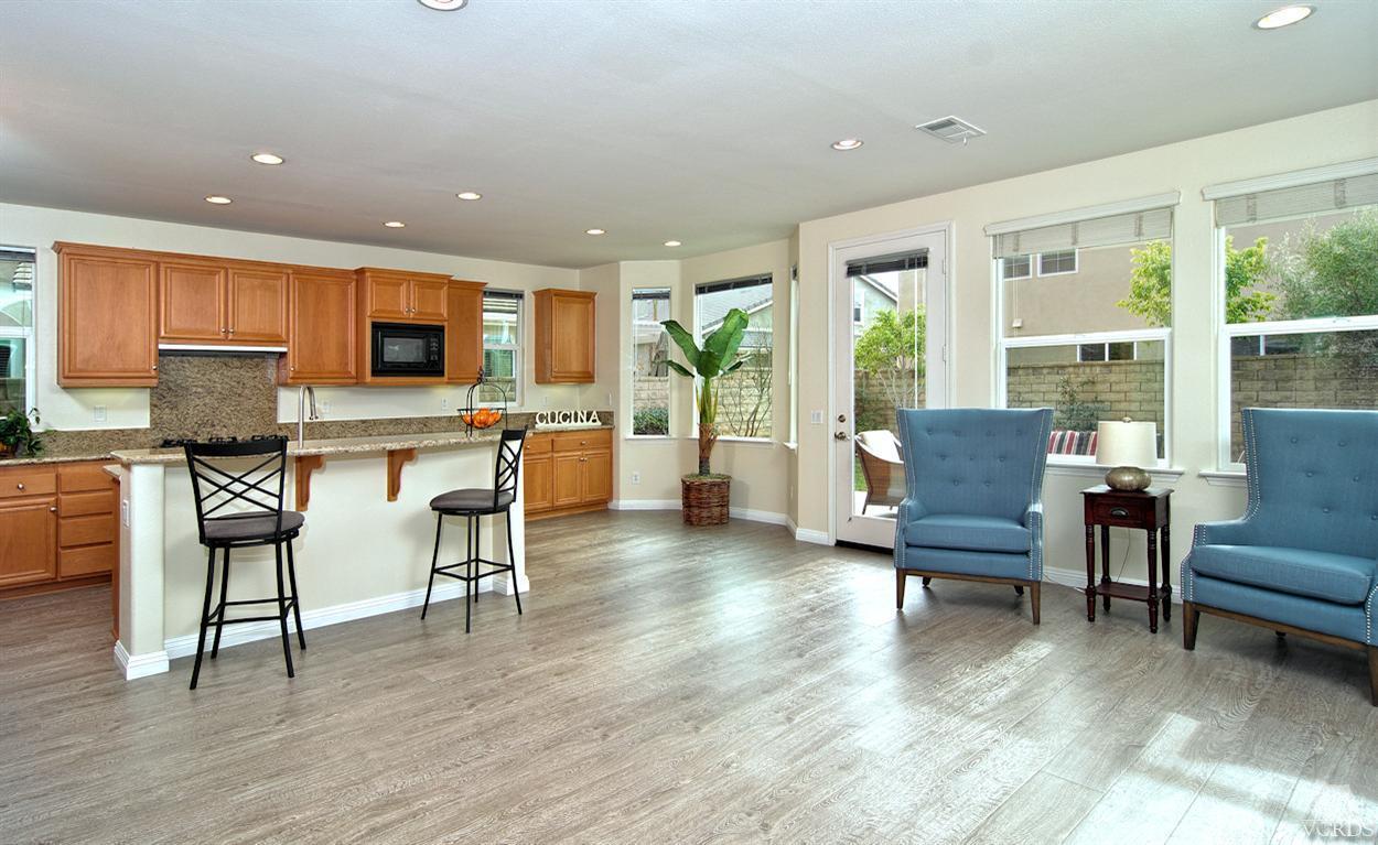 3522 Bridgehampton Way Camarillo, CA 93012 - Photo 14 of 52 a living room with furniture and a flat screen tv with wooden floor