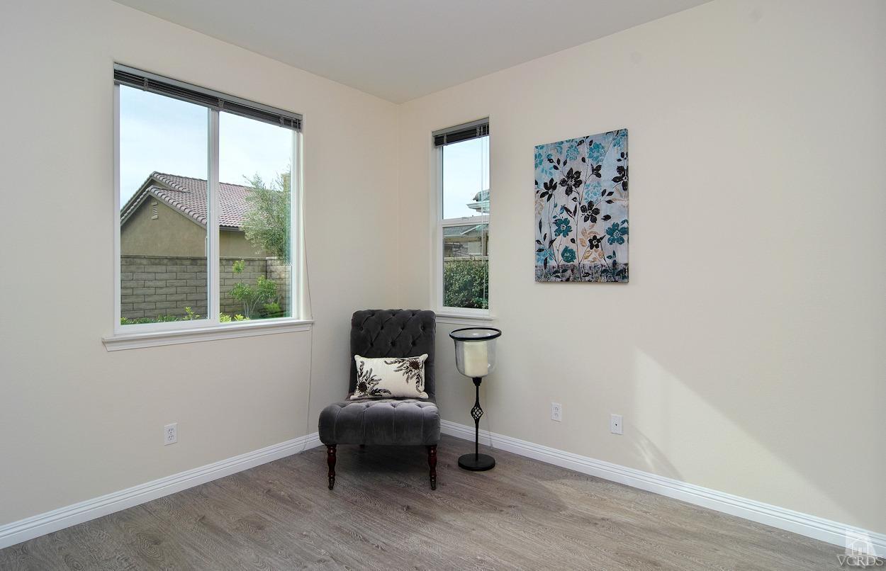 3522 Bridgehampton Way Camarillo, CA 93012 - Photo 17 of 52 a living room with a chair and a window
