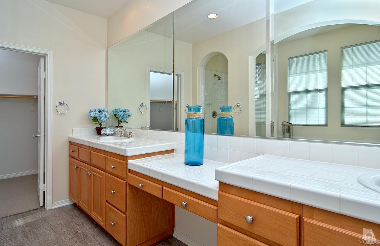 3522 Bridgehampton Way Camarillo, CA 93012 - Photo 22 of 52 a bathroom with a sink and a mirror