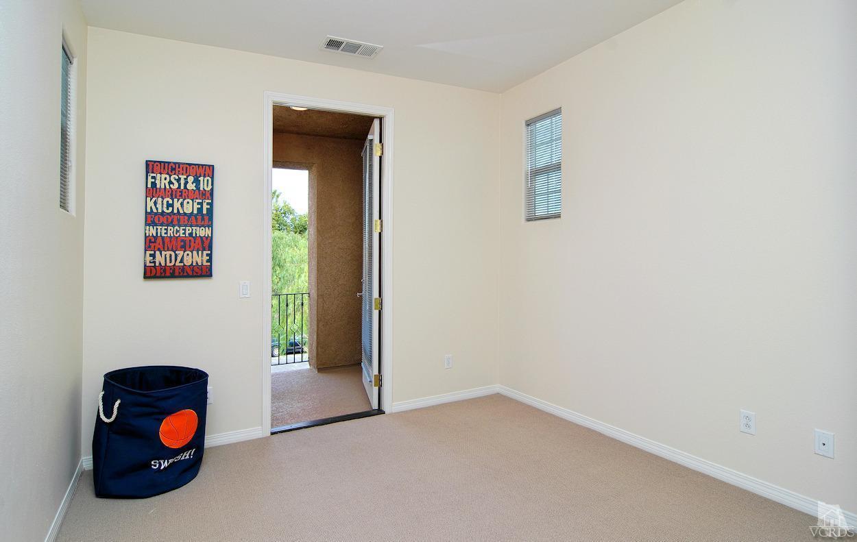 3522 Bridgehampton Way Camarillo, CA 93012 - Photo 29 of 52 a view of a hallway to room with a window and a ceiling fan