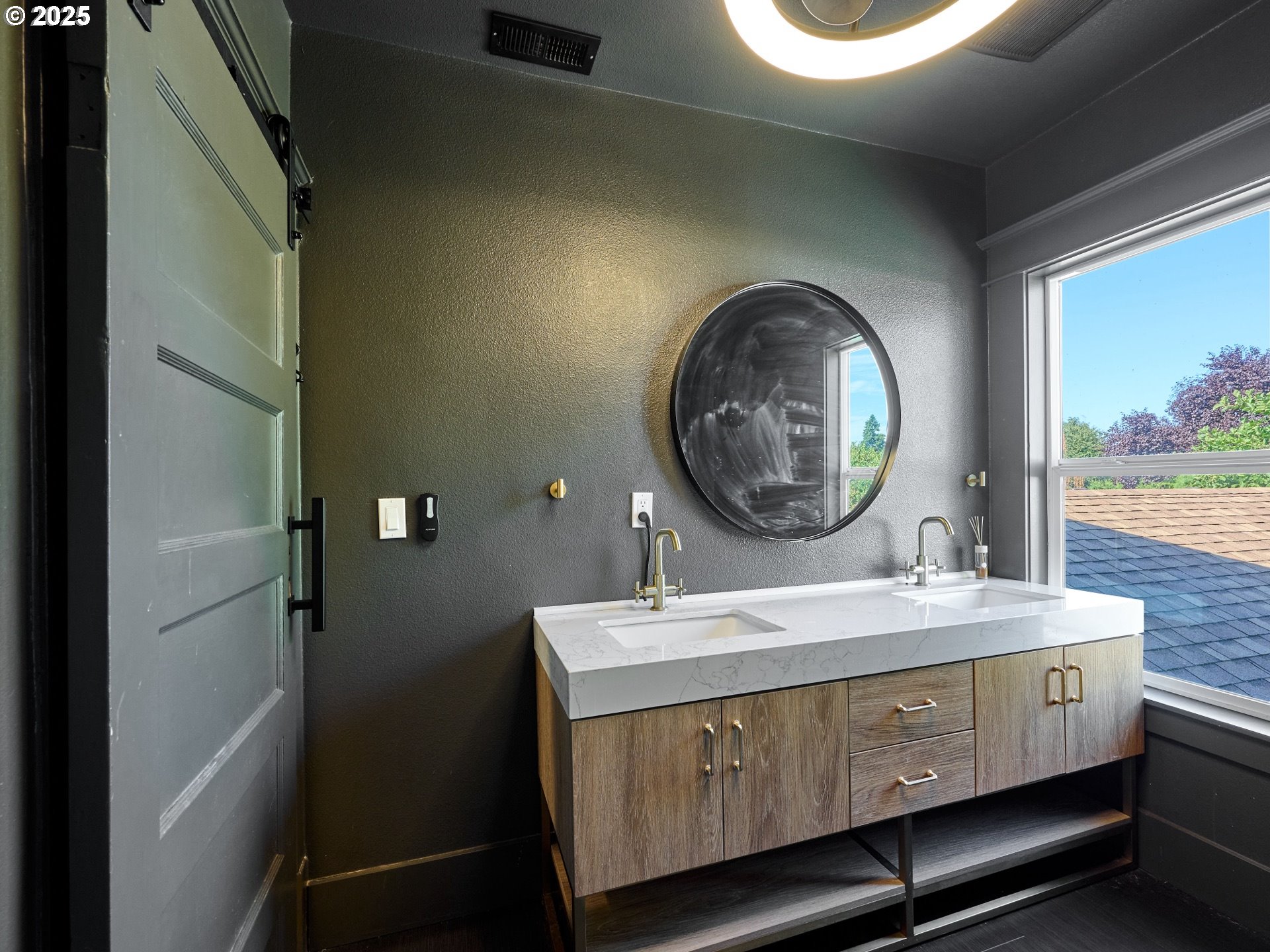 795 Corby Street Woodburn, OR 97071 - Photo 23 of 44 a bathroom with a sink and a mirror