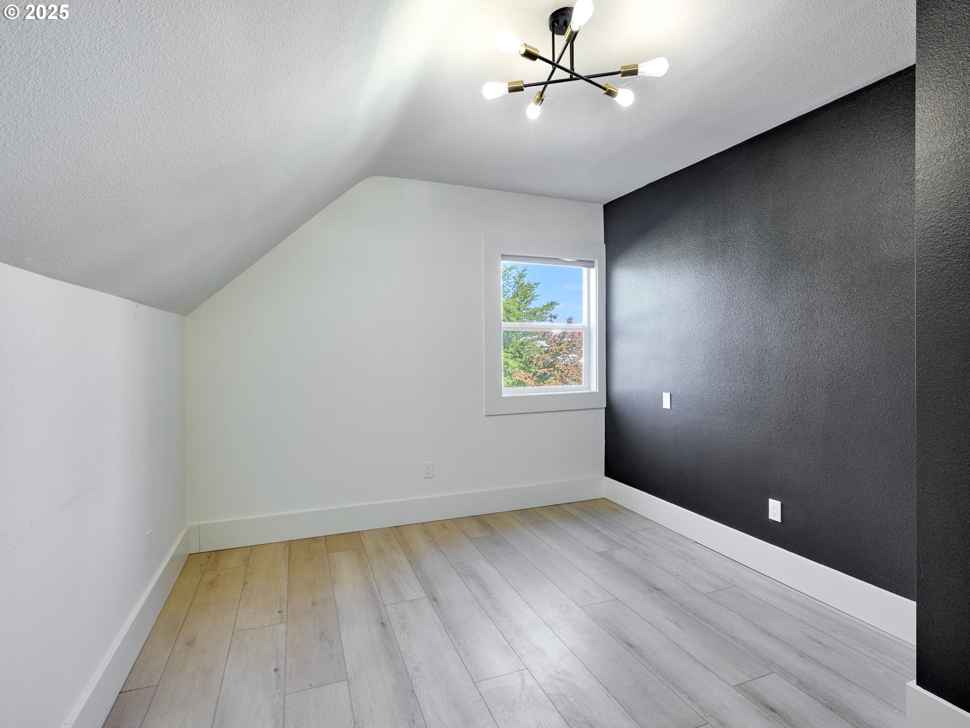 795 Corby Street Woodburn, OR 97071 - Photo 25 of 44 wooden floor in an empty room with a window