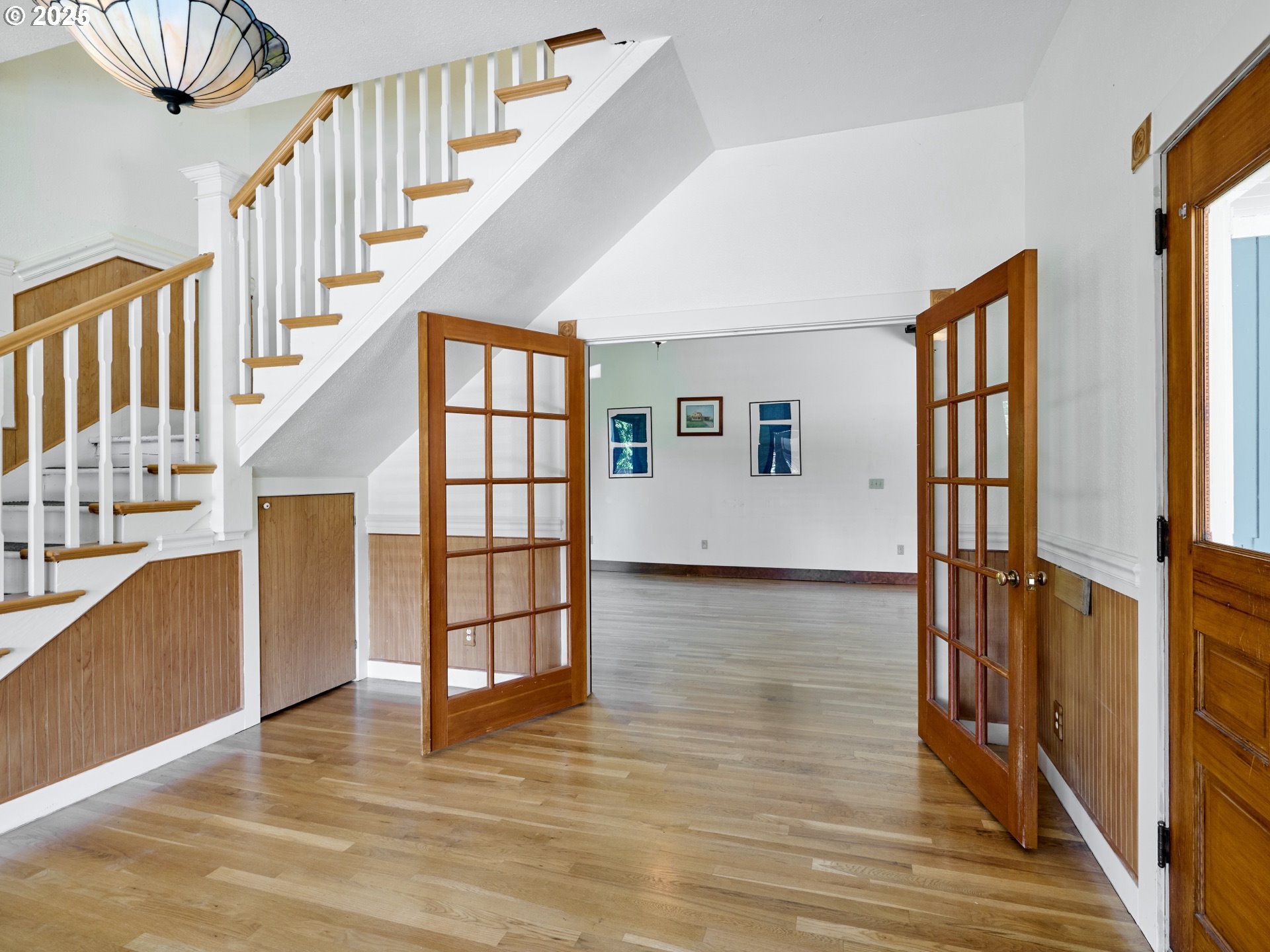 795 Corby Street Woodburn, OR 97071 - Photo 5 of 44 a view of an entryway with wooden floor and door