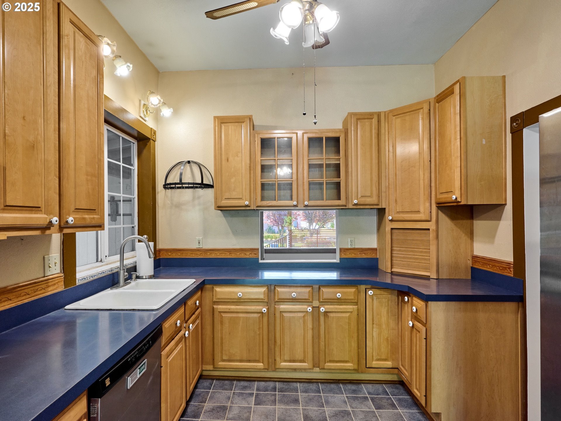 795 Corby Street Woodburn, OR 97071 - Photo 8 of 44 a kitchen with stainless steel appliances granite countertop a sink and cabinets