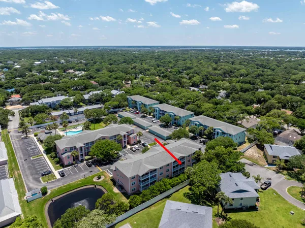 an aerial view of a house with a garden