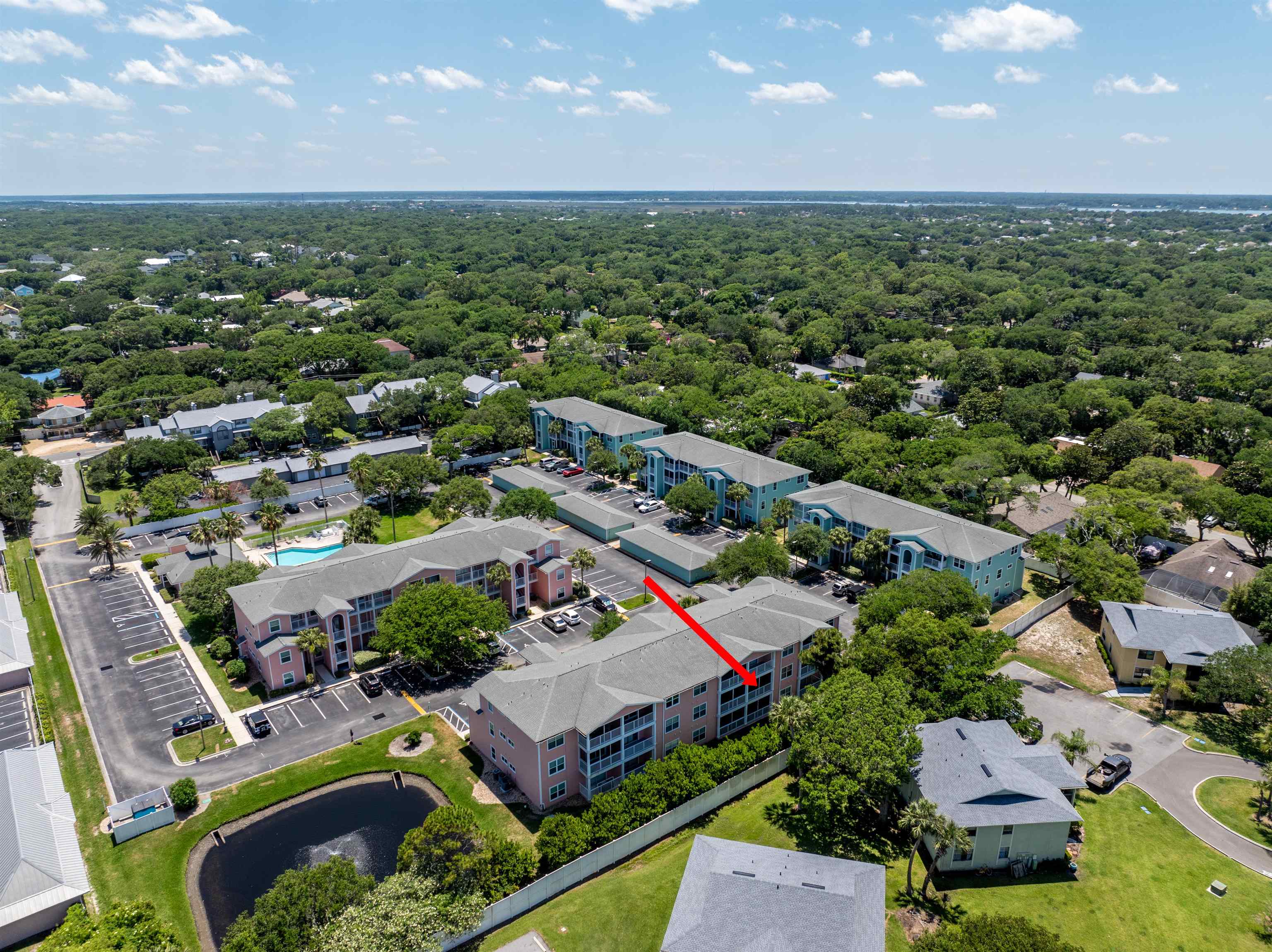 210 16th Street, Unit H St. Augustine, FL 32080 - Photo 11 of 39 an aerial view of a house with a garden