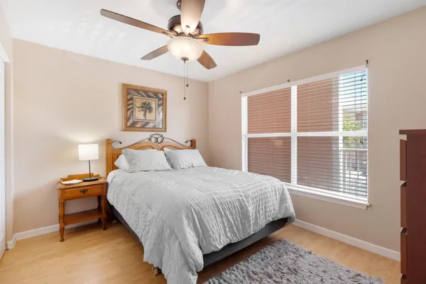 a bedroom with bed and a window