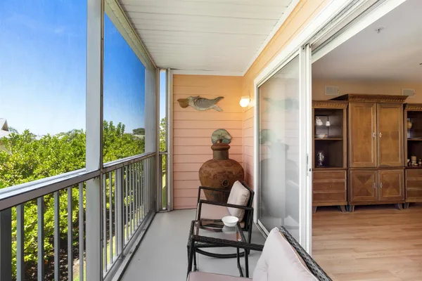 a view of a balcony with chairs
