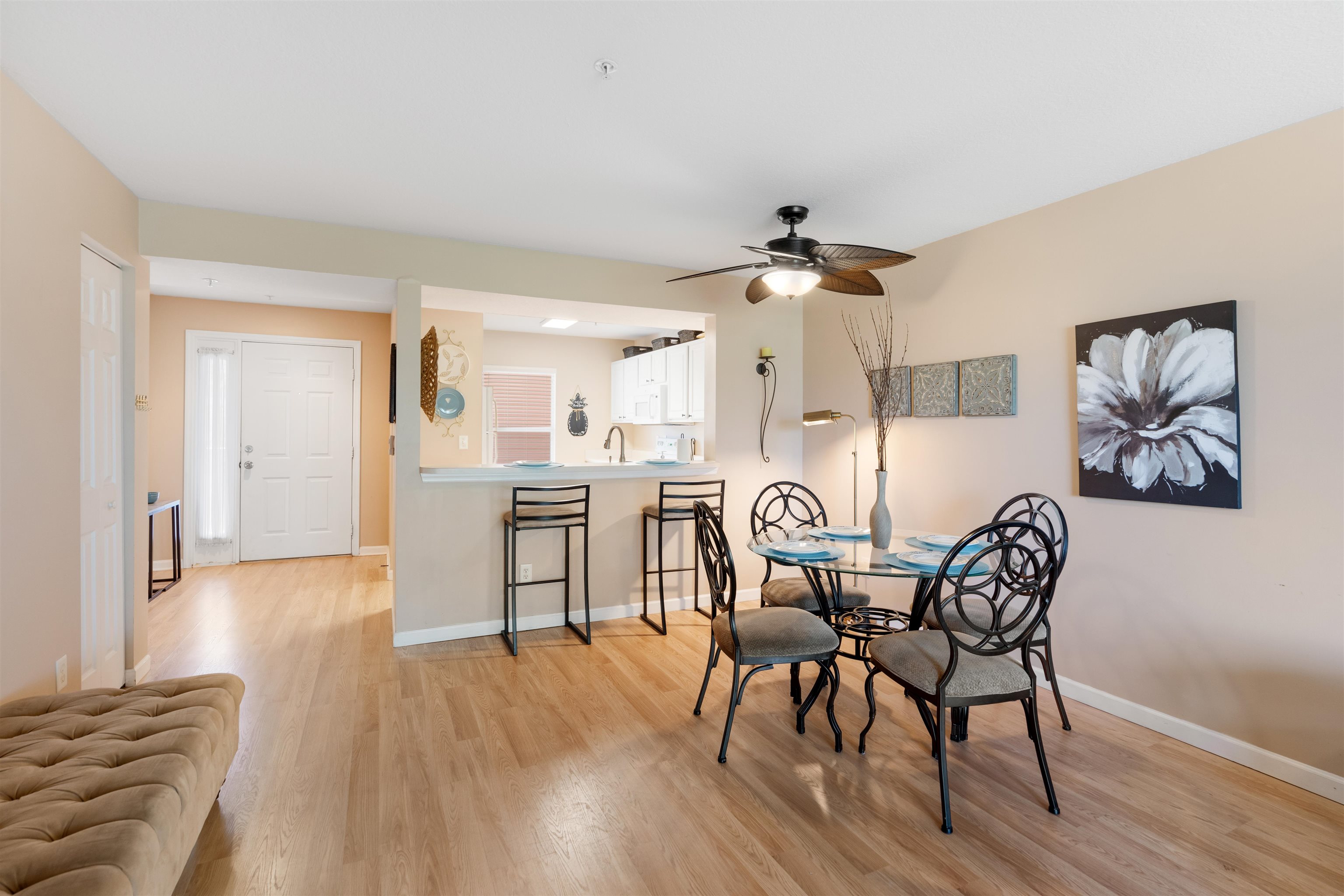 210 16th Street, Unit H St. Augustine, FL 32080 - Photo 29 of 39 a view of a dining room with furniture and wooden floor
