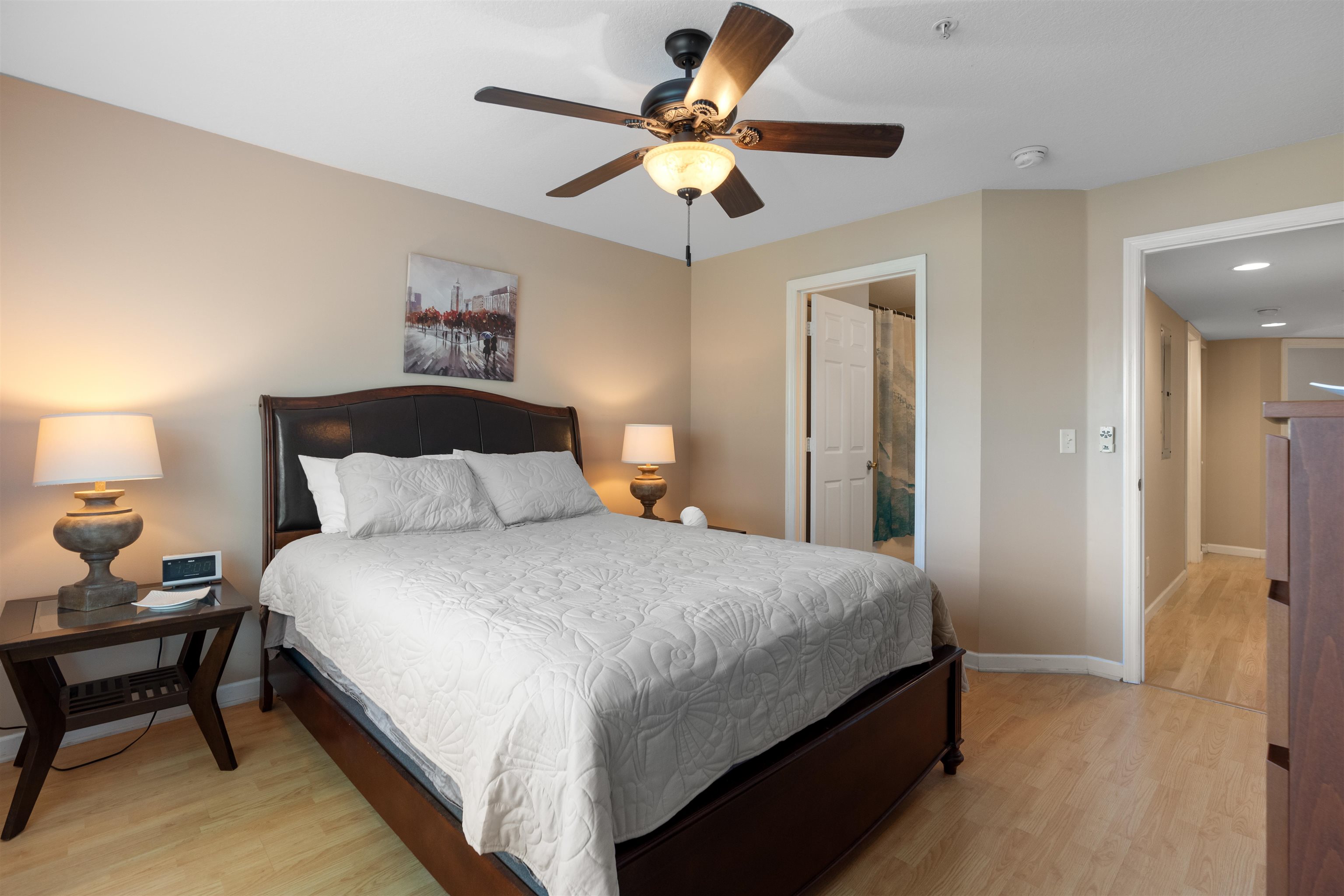 210 16th Street, Unit H St. Augustine, FL 32080 - Photo 36 of 39 a bedroom with bed and a chandelier