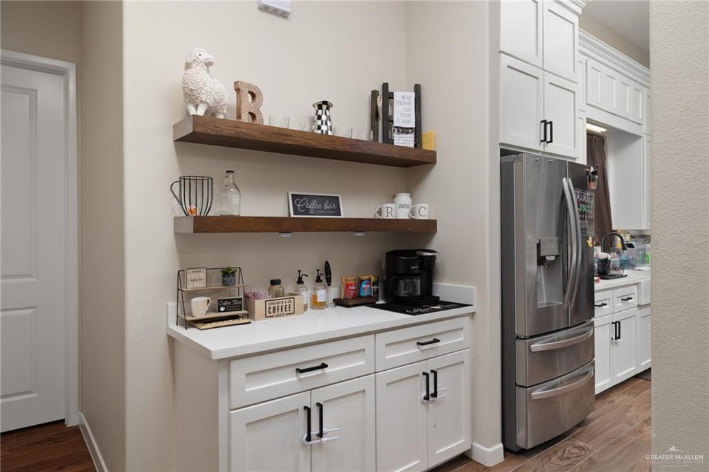 4650 North Big 5 Road Edinburg, TX 78541 - Photo 14 of 26 a kitchen with stainless steel appliances a refrigerator and cabinets