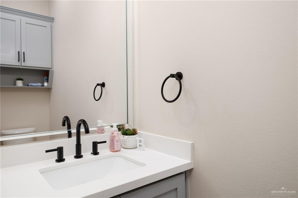 4650 North Big 5 Road Edinburg, TX 78541 - Photo 15 of 26 a bathroom with a sink and a mirror