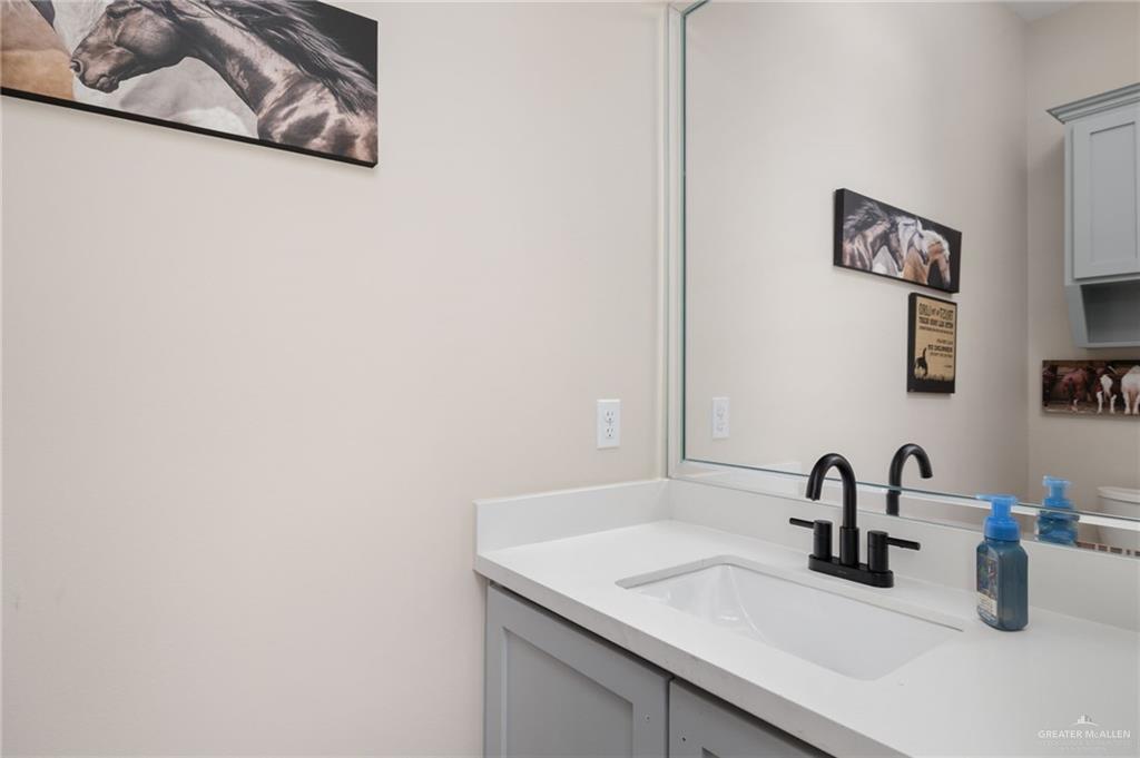 4650 North Big 5 Road Edinburg, TX 78541 - Photo 19 of 26 a bathroom with a sink and a mirror