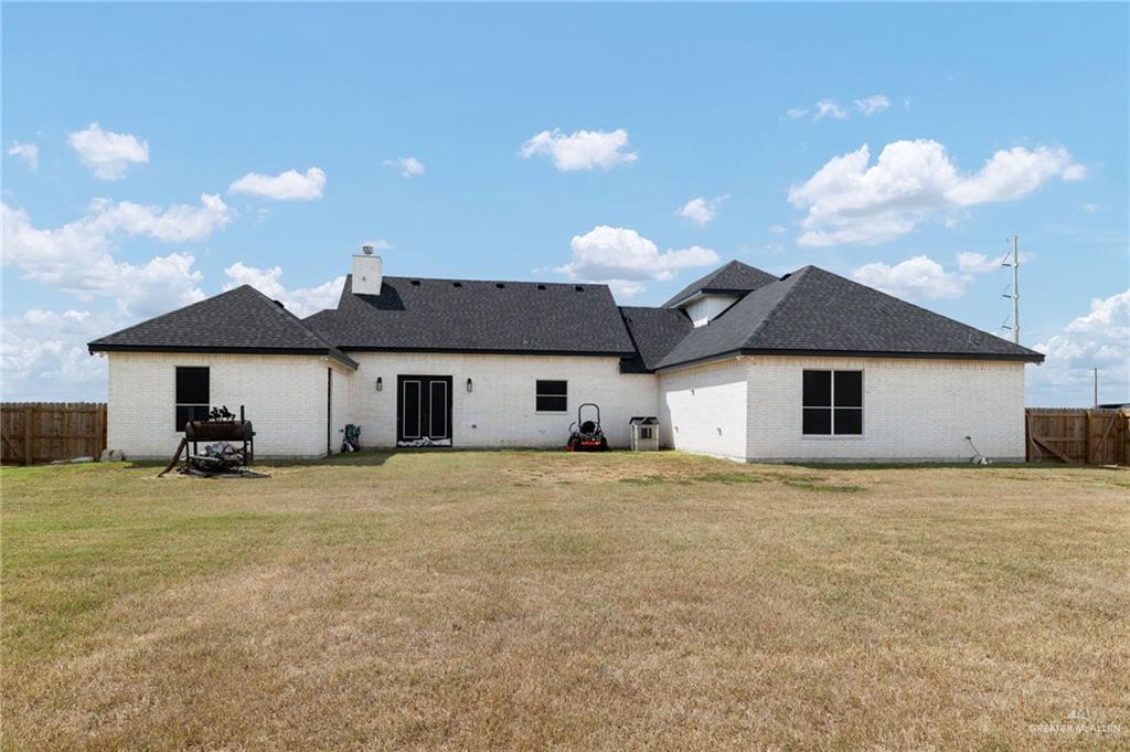 4650 North Big 5 Road Edinburg, TX 78541 - Photo 20 of 26 a big house with a big yard and large trees
