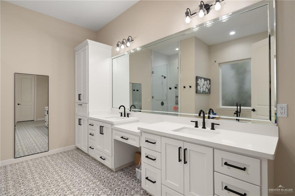 4650 North Big 5 Road Edinburg, TX 78541 - Photo 9 of 26 a bathroom with a double vanity sink mirror and double