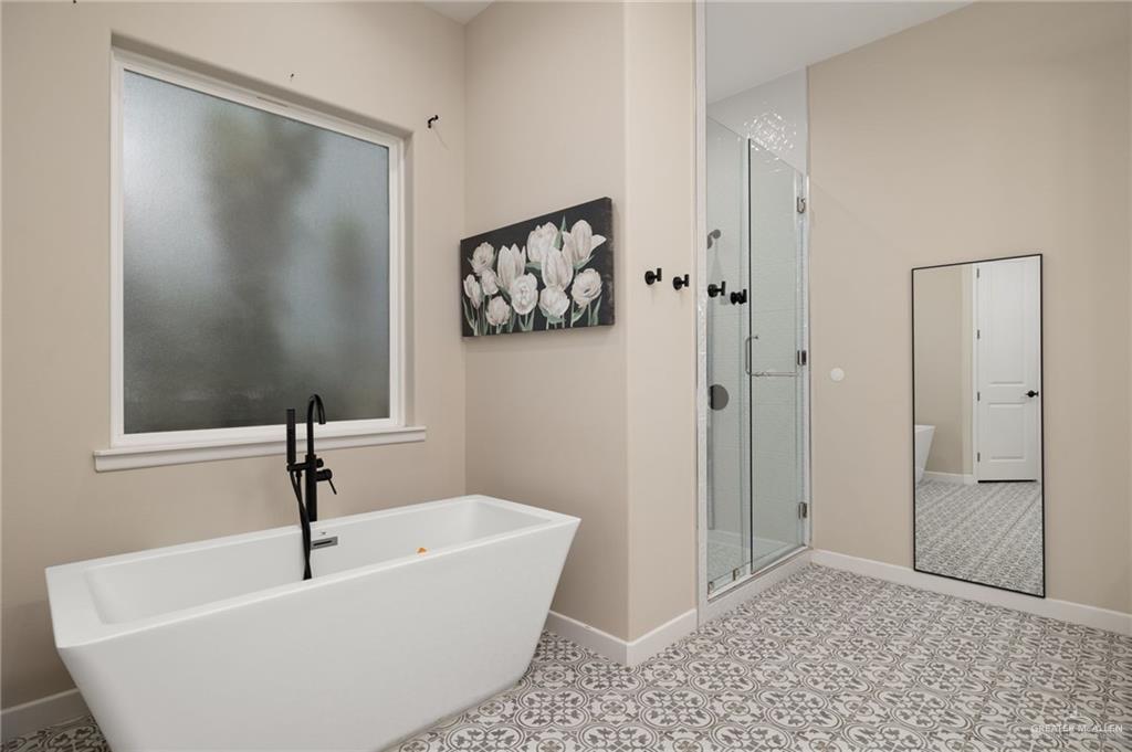 4650 North Big 5 Road Edinburg, TX 78541 - Photo 10 of 26 a bathroom with a bathtub and shower