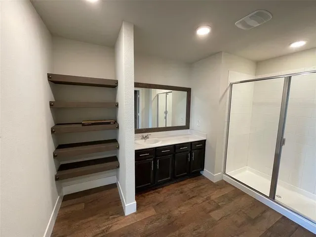 a view of a livingroom with a ceiling fan and window