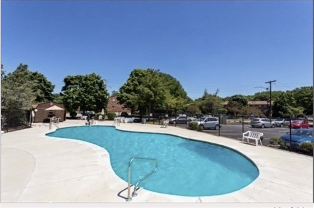 22 Westgate Road, Unit 3 Boston, MA 02467 - Photo 18 of 18 a view of a swimming pool with outdoor seating