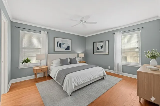 a bedroom with a large bed couch and a window