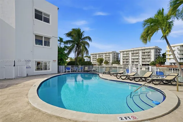 a view of swimming pool with outdoor seating and plants