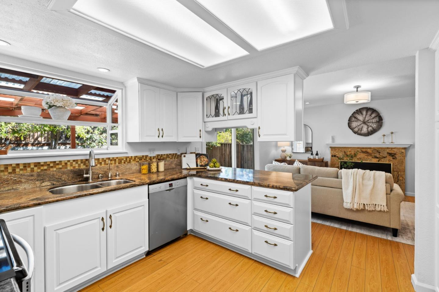 1386 Prada Court Milpitas, CA 95035 - Photo 12 of 36 a kitchen with white cabinets and window