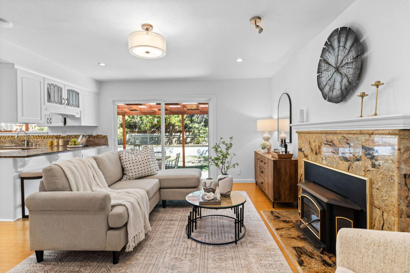 1386 Prada Court Milpitas, CA 95035 - Photo 13 of 36 a living room with furniture a fireplace and a flat screen tv