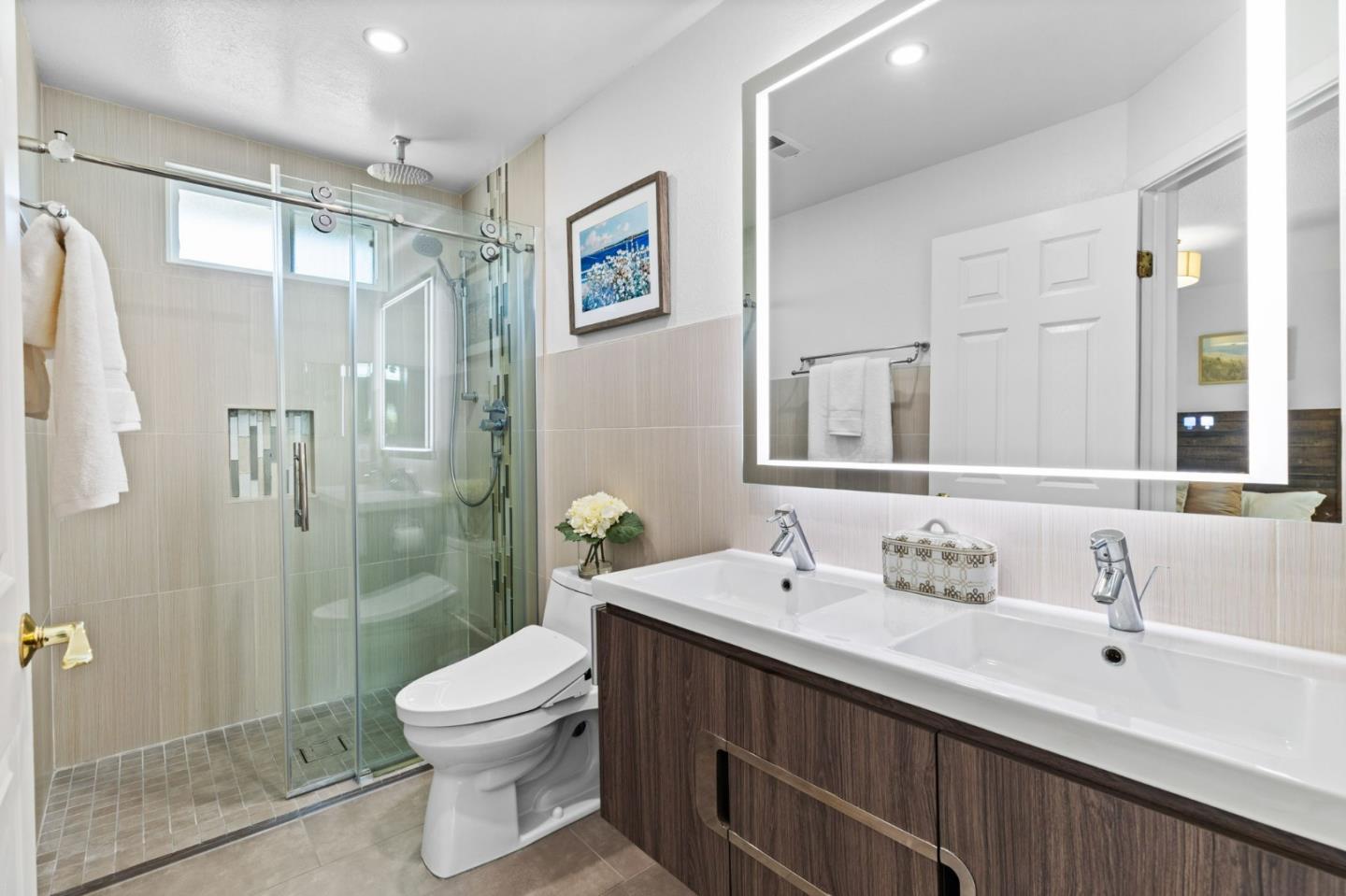 1386 Prada Court Milpitas, CA 95035 - Photo 17 of 36 a bathroom with a sink and a mirror