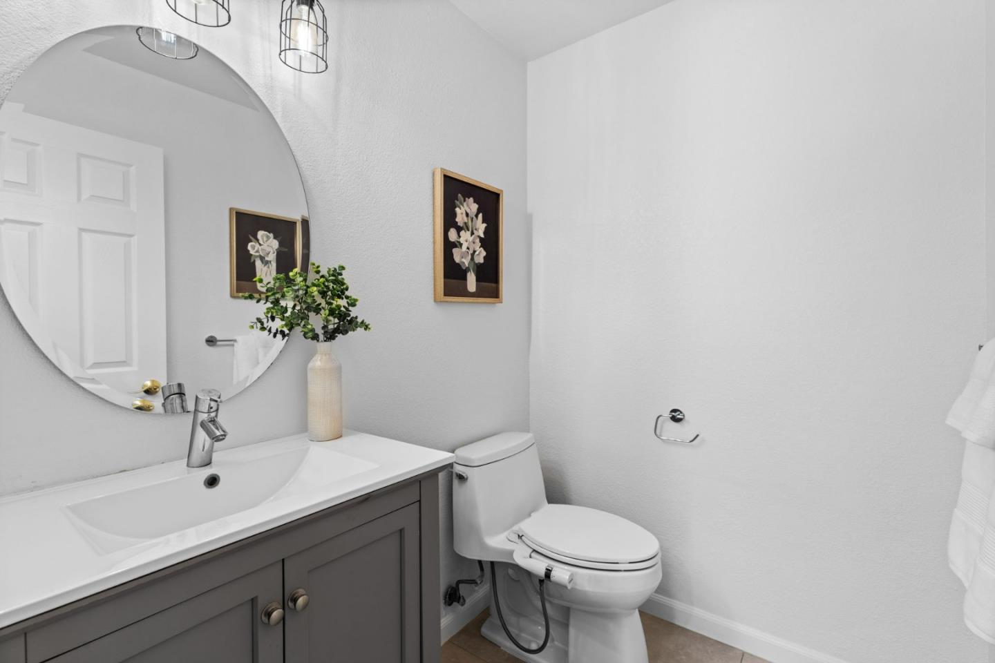 1386 Prada Court Milpitas, CA 95035 - Photo 19 of 36 a bathroom with a toilet sink and mirror