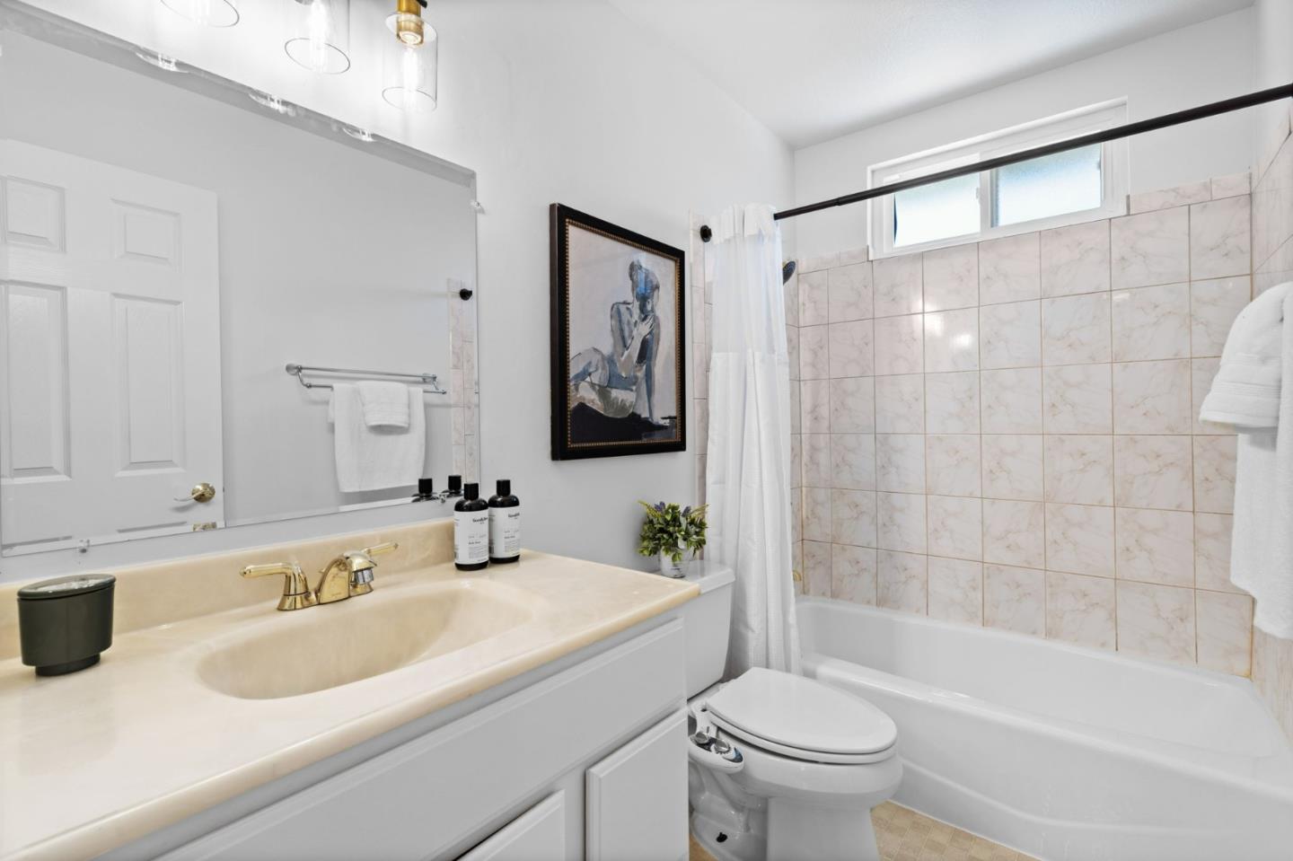 1386 Prada Court Milpitas, CA 95035 - Photo 22 of 36 a bathroom with a sink a toilet and a bathtub