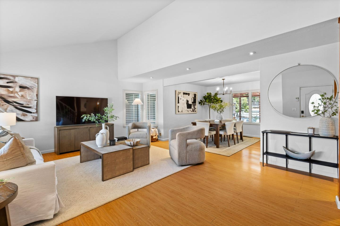 1386 Prada Court Milpitas, CA 95035 - Photo 4 of 36 a living room with furniture a flat screen tv and a large window