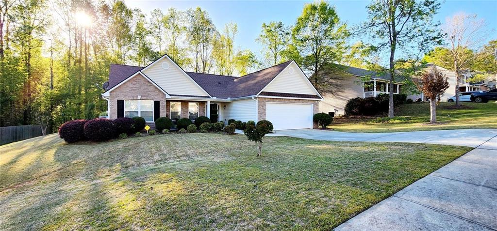 744 Thompson Ridge Court Monroe, GA 30655 - Photo 1 of 1 a house view with a garden space